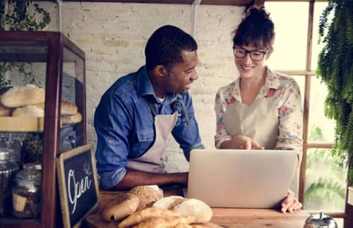 small-business-owner-baker-website-laptop