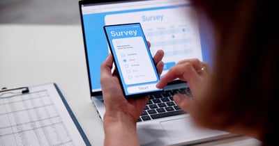 Close-up Of Person Filling Online Survey Form