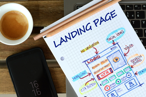 Website landing page development – sketch on a book