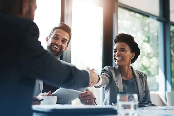Happy business people, handshake and meeting.