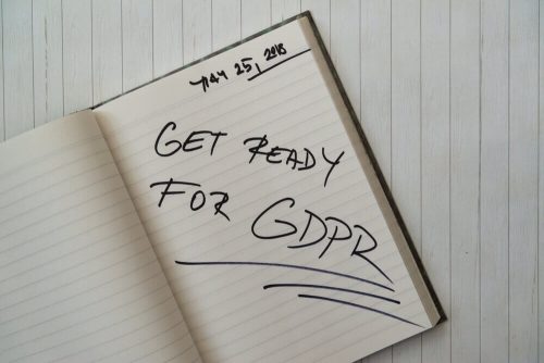 Open notebook, with 'get ready for gdpr' written in black ink.