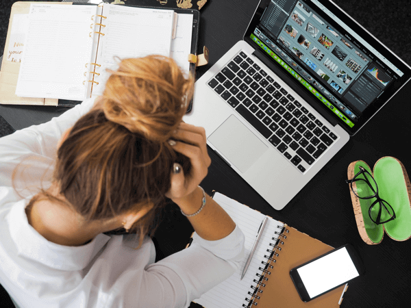 How to Create A List of Blog Topics Without Pulling Your Hair Out woman pulling hair out