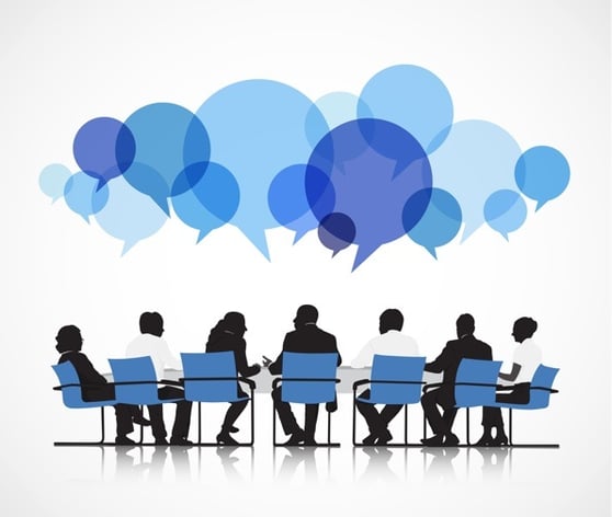 Graphic of a group of people sitting at a table, with various blue speak bubbles above their heads.