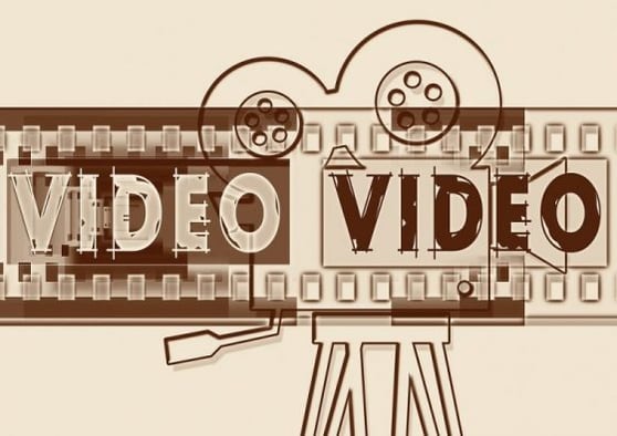 Graphic that says Video, with graphic of movie film on the background.