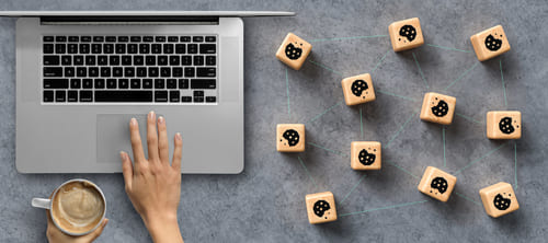 Dice with Cookie icons and a laptop