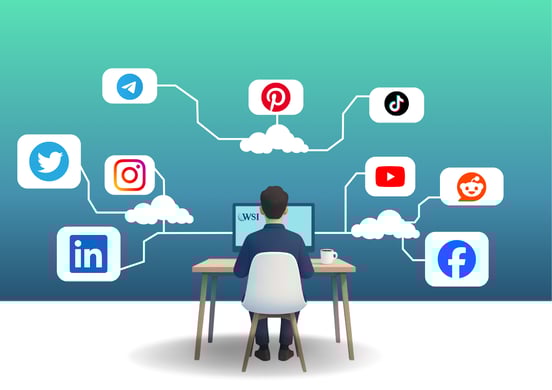 Individual managing social platforms from a desk, showing a strategy for loyalty building on social media.